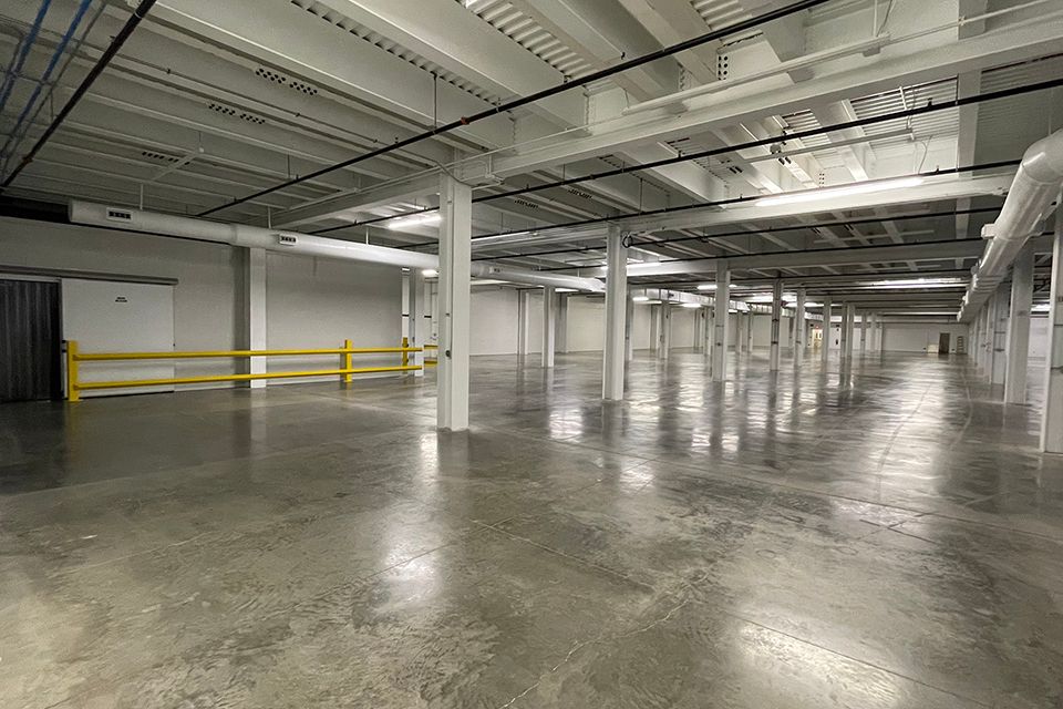 Open space with concrete floors and access to a loading dock