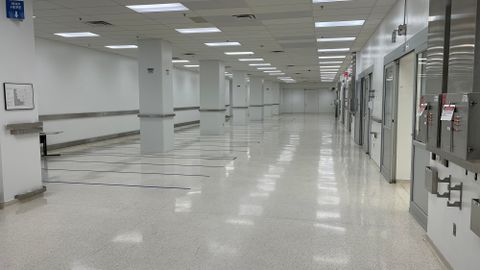 Open space with linoleum floors and access to secure bays