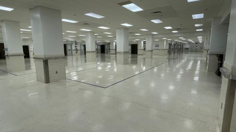 Open space with linoleum floors and access to secure bays