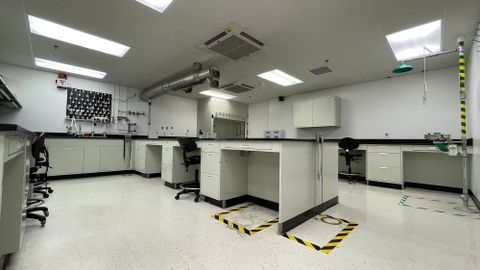 Lab space with eyewash station, storage and sinks